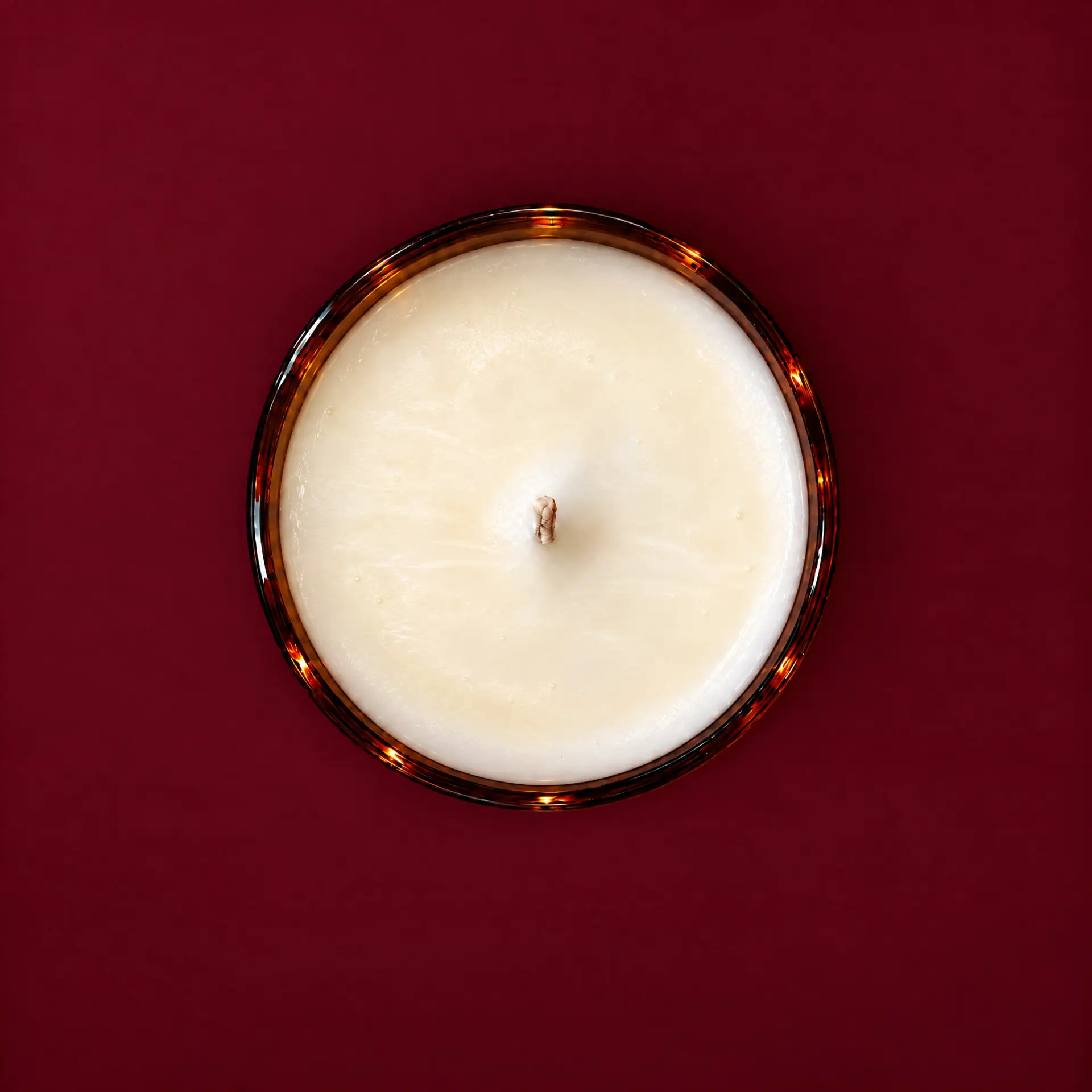 Where the Rose Fell Quiet candle in burgundy glass